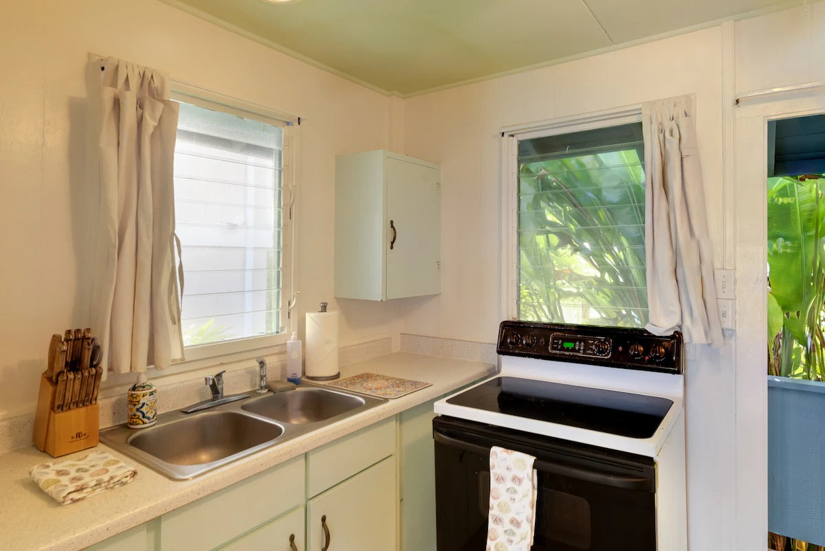Laʻau Paina Beachfront Estate | House + Cottage